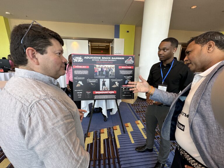 Volusia Innovation Challenge Showcase exhibitor speaking to guests
