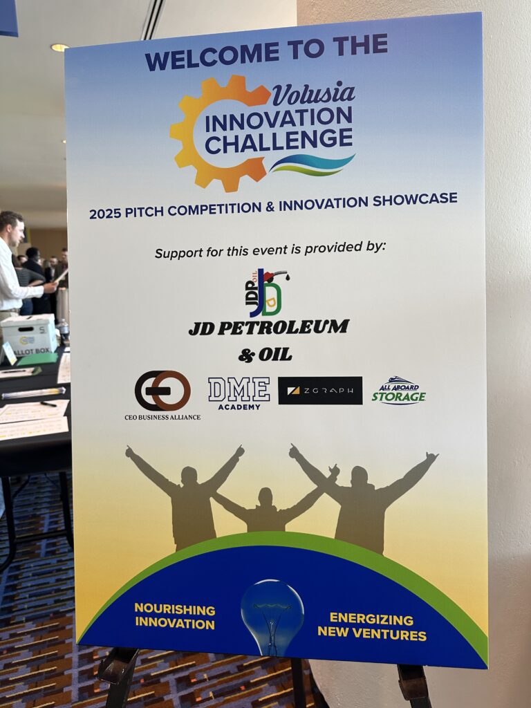 Photo of Volusia Innovation Challenge poster with sponsor logos