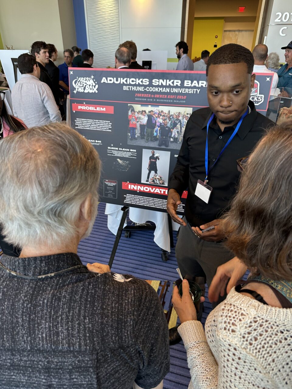 Volusia Innovation Challenge Showcase exhibitor speaking to guests