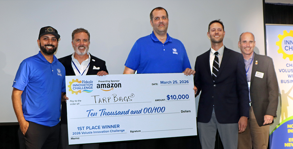 Group photo with representatives from Amazon, Volusia County Economic Development and the 1st place winner Steve Lofvers holding the big check for $10,000 for his innovative product TarpBags